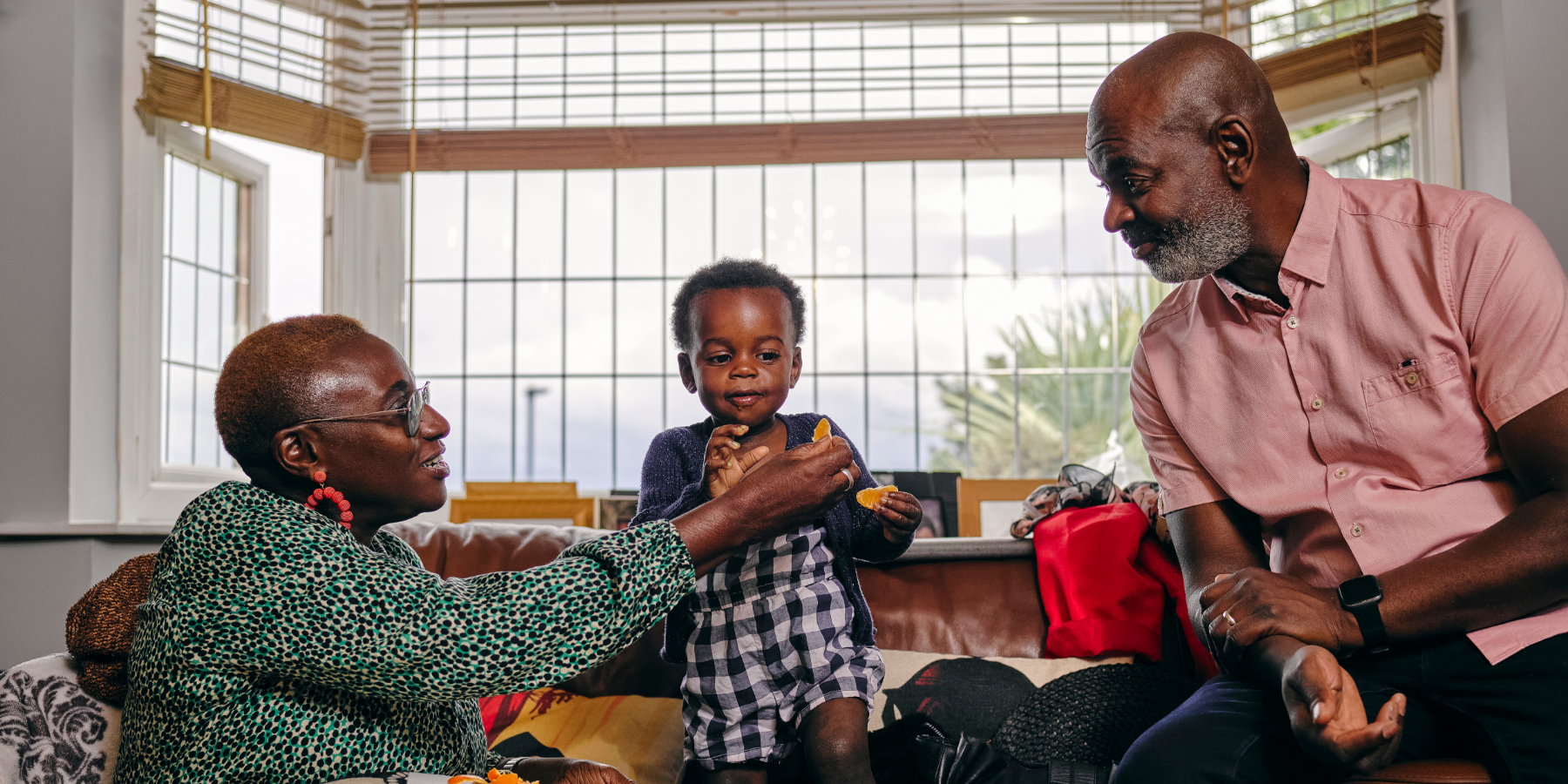 Grandparents with grandchild at home