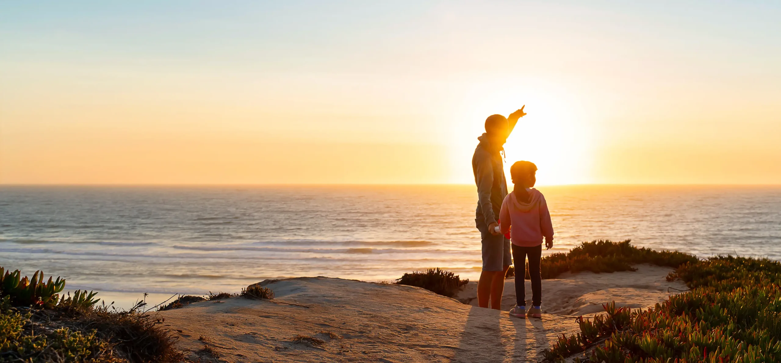 Man and Daughter at Sunset