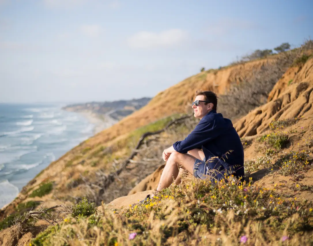 Man Sitting at the Beach