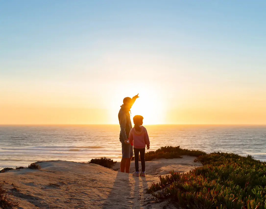 Man and Daughter at Sunset