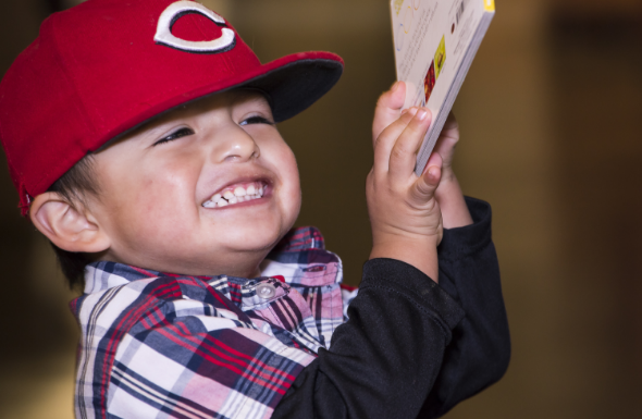 Young boy happy to have a book