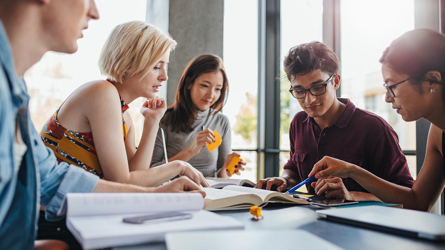 College students studying together at table