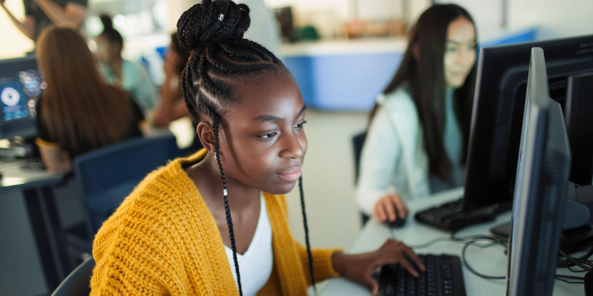 Student using computer in classroom