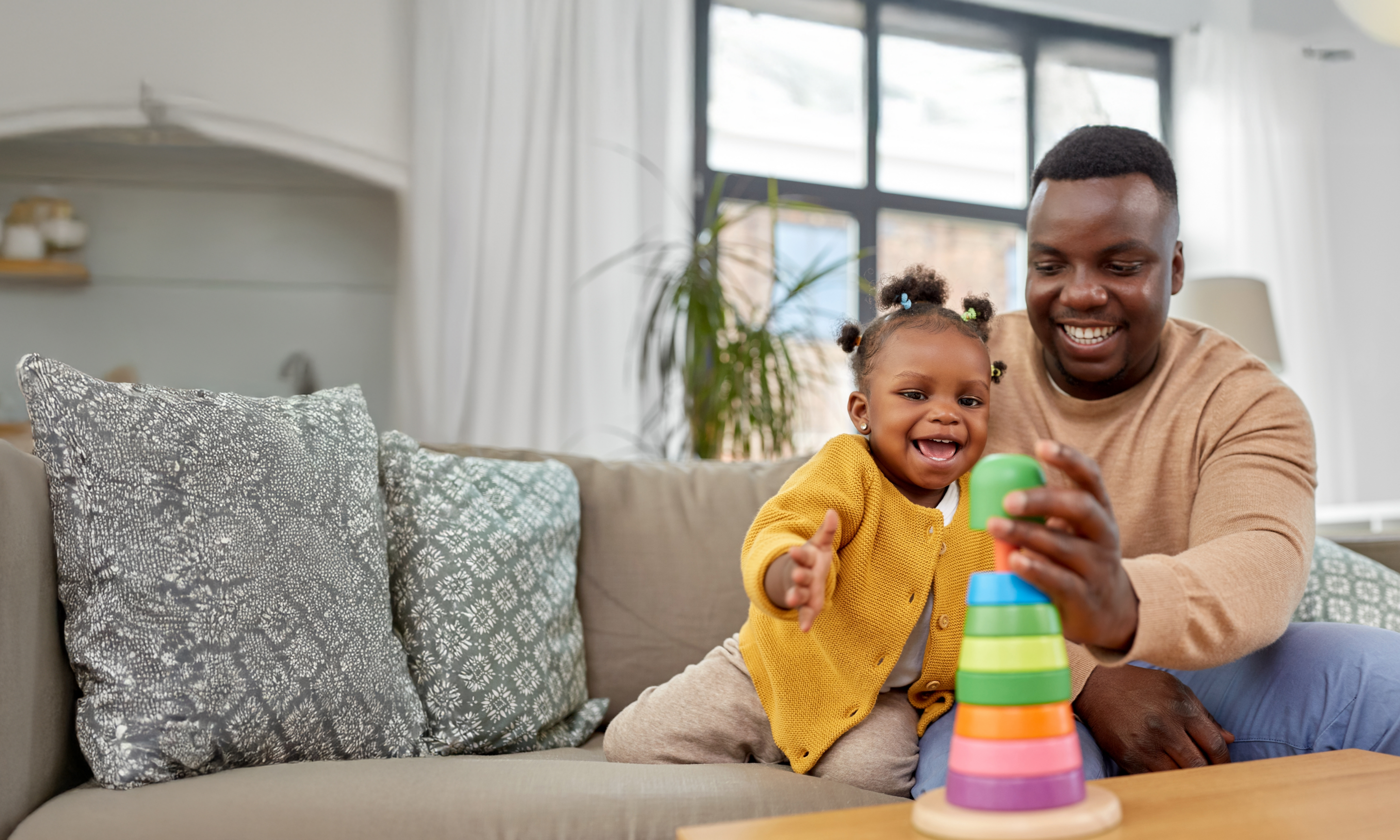 Father playing with smiling child